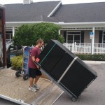 Putting a commercial freezer in the moving trailer