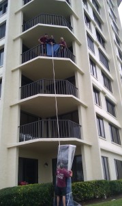 hoisting Couch Diring A Move In Island Estates, Clearwater, Florida